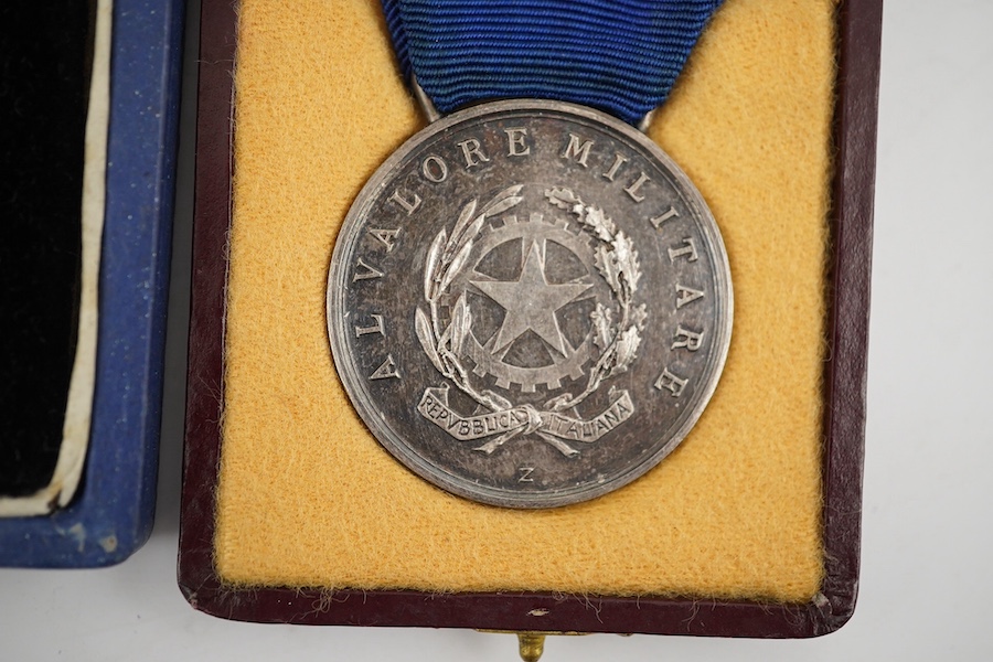 Two cased World War II medals; a Spanish 'Grand Cross of Al Merito En Campana', ('Order of Merit in the Campaign') breast star and an Italian medal of military valour, inscribed and dated 1943. Condition - fair to good.